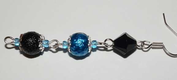 Assembled earring dangle with two blue beads and a black insert
