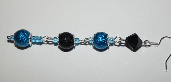 Finished earring made of blue beads and a black faceted bead