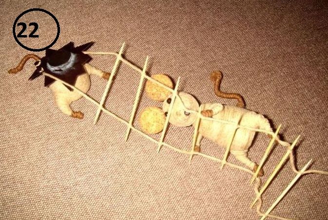 Two cork mice on a string ladder