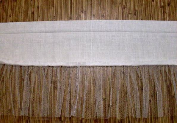 Gathered netting sewn to the upper petticoat strip