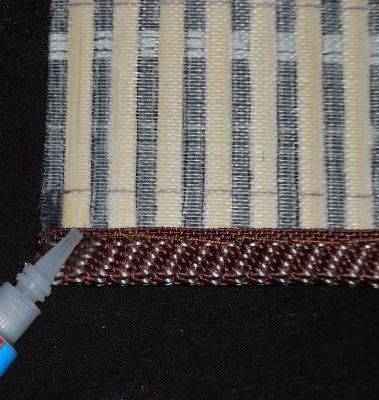 Close-up of the cut edge with glue applied to prevent fraying