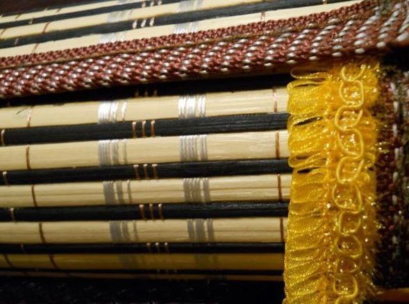 Decorative ribbon glued near the trim on both sides of the tube