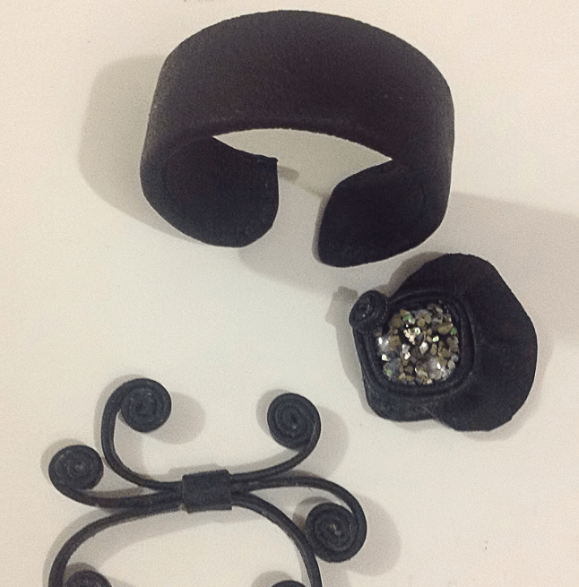 Leather bracelet and decorative pieces before assembly