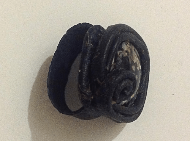 Finished leather bracelet with a decorative center