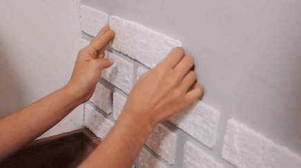Sticking the brick to the wall