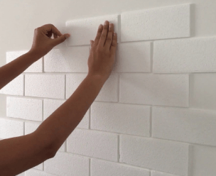 Finished wall with faux brick decor