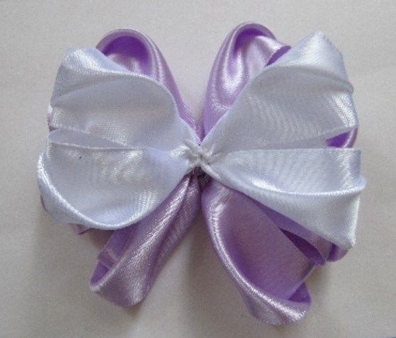 White part of the bow layered over the lilac base