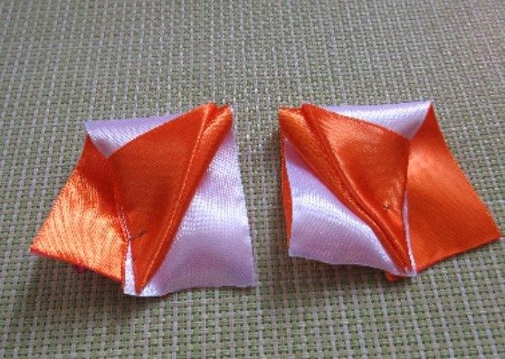 Two finished satin ribbon petal pieces