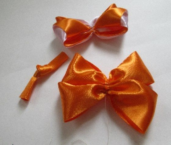 Finished bow and orange satin ribbon pieces