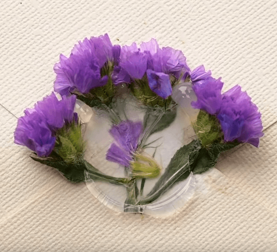 A gift box decorated with flowers and a seal