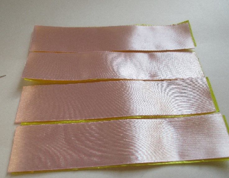 Satin ribbons cut into equal lengths for the bow