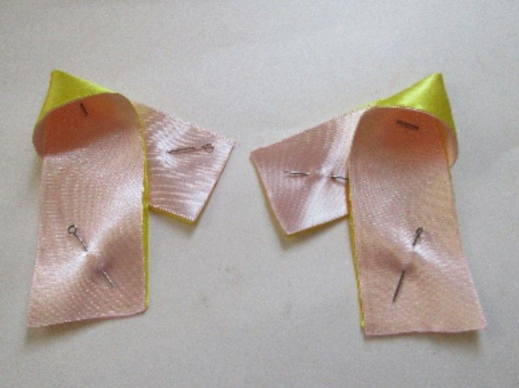 First symmetrical bow petals formed from the ribbons
