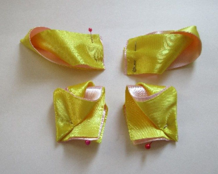 Gathered bow base being cinched at the center