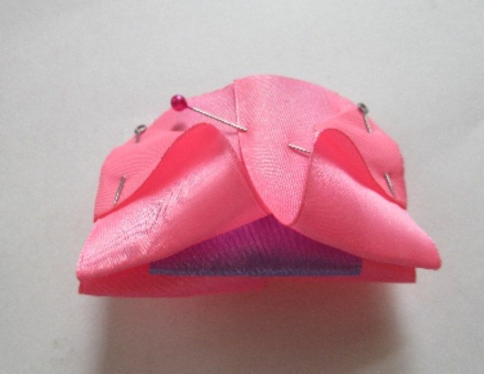 Pinned pink and lilac ribbons for a bow