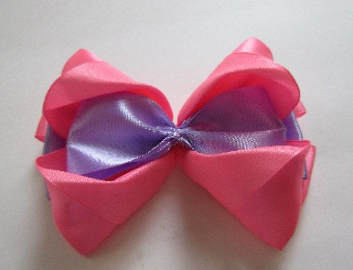 Assembled two-color bow in pink and lilac ribbon