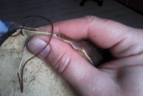 Shaping the wire frame for the toy spider's legs