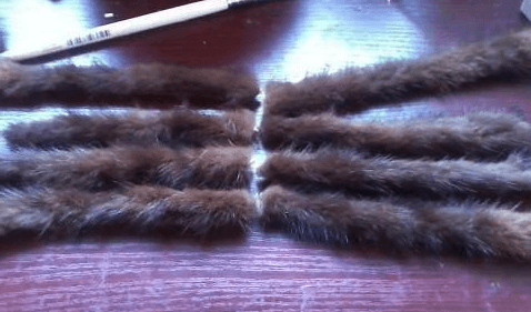 Fur legs glued onto the toy spider's base
