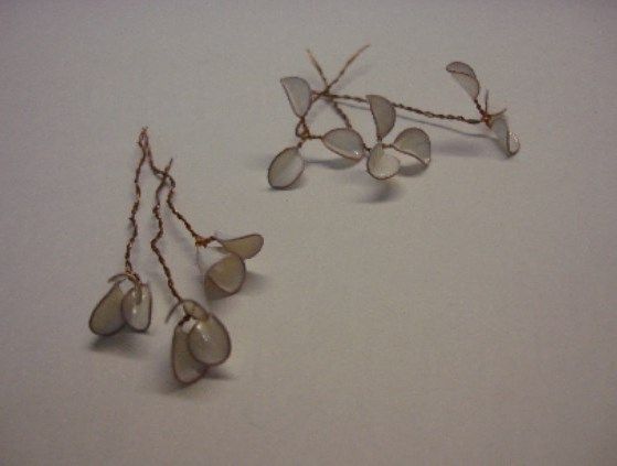 Two branches with half-open wire flowers and buds