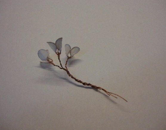 Small branch of several flowers on a wire stem