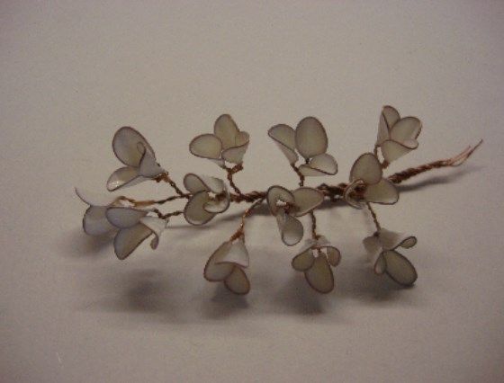 Small branch of white wire-and-nail-polish flowers