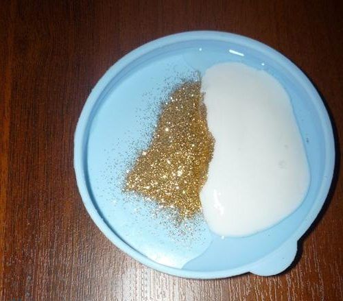 PVA glue and gold glitter in a bowl