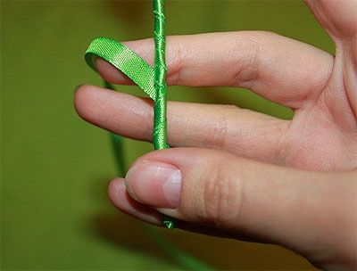 Wrapping the stem with green ribbon