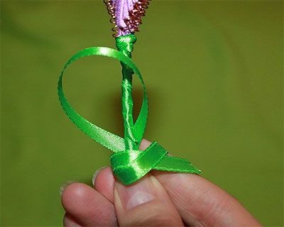 Base of the ganutell flower wrapped with green ribbon