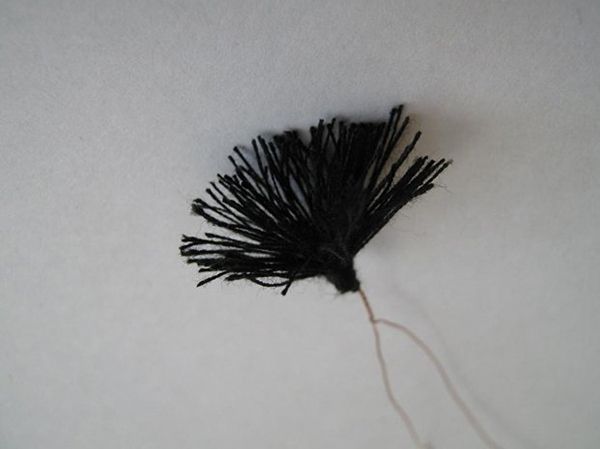 Bundle of black threads for the center of a poppy flower