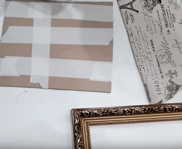 Cardboard backing covered in wrapping paper