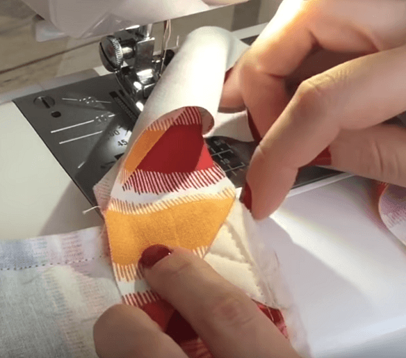 Forming the binding corner by hand before folding