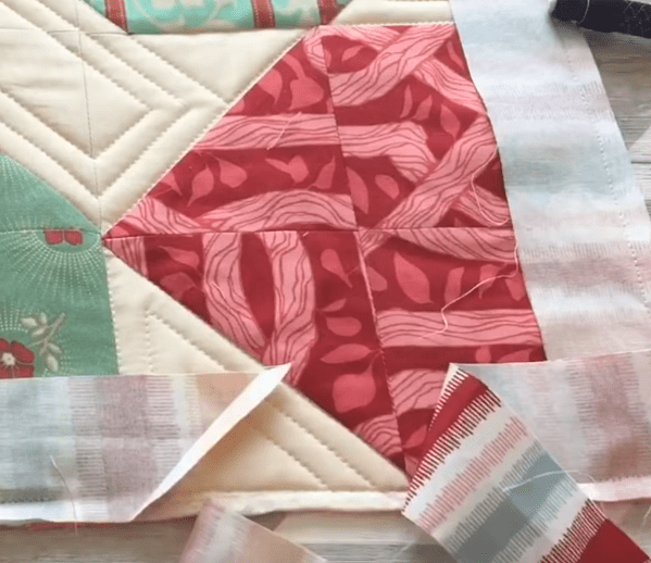 Quilted corner with binding folded to finish the corner