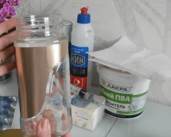 Glass jar, glue, paint, and napkins for decoupaging a vase