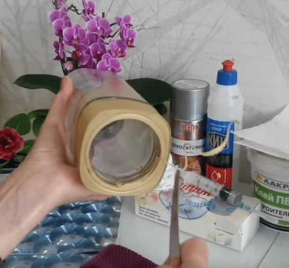 Jar lid with a hole cut for the neck
