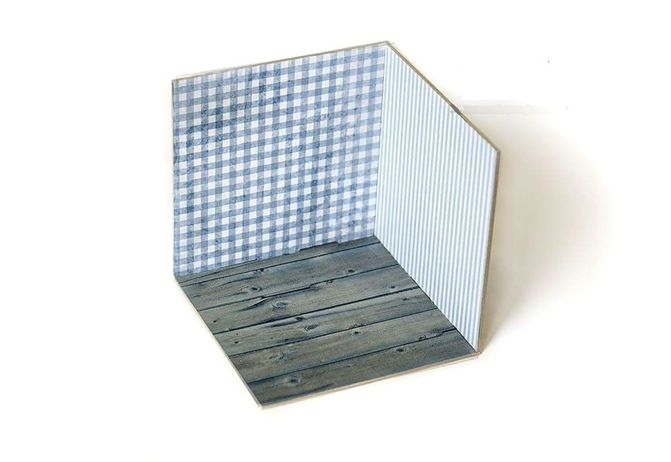 Assembled corner-style 3D photo backdrop with a light wood floor