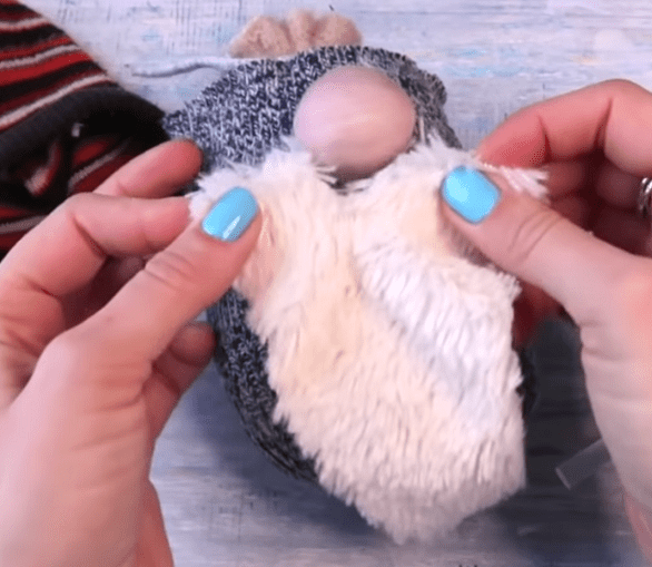 Gluing the beard to the sock gnome's body
