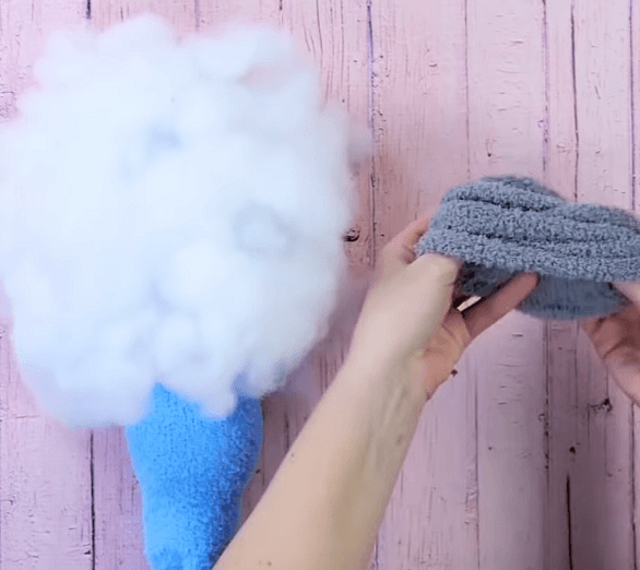 Filling the sock with polyester batting for the penguin toy