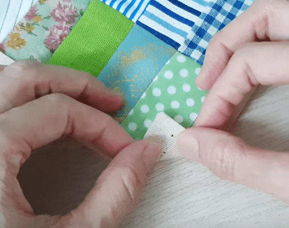 Forming the first fold at the backing's corner