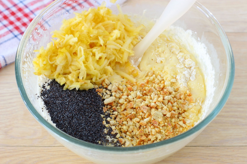 Grated apple, poppy seeds, and chopped candied fruit added to muffin batter